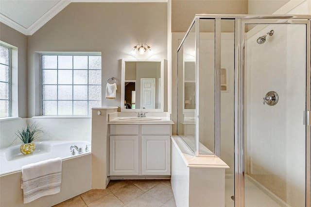 bathroom featuring crown molding, vanity, vaulted ceiling, tile patterned floors, and shower with separate bathtub