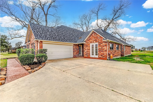 view of side of property featuring a garage and a yard