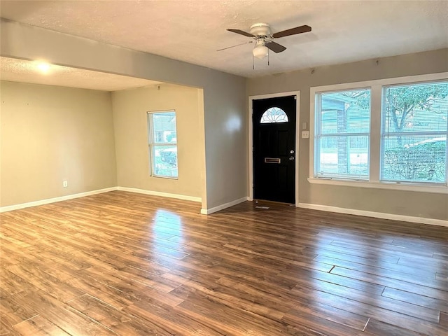 entryway with hardwood / wood-style flooring, ceiling fan, and a textured ceiling