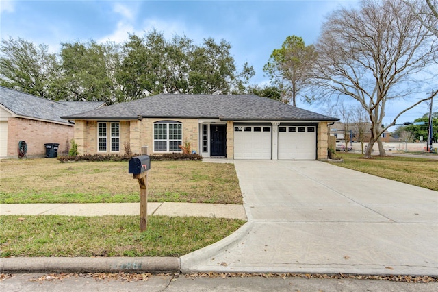 single story home with a garage and a front yard