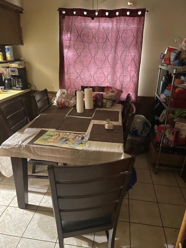 dining space with light tile patterned floors