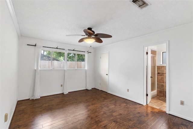 empty room featuring crown molding, ceiling fan, dark hardwood / wood-style floors, and a textured ceiling