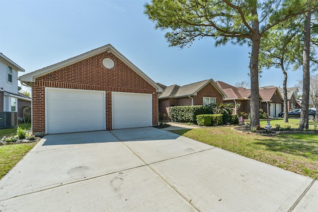 single story home featuring a front yard, central AC, and brick siding