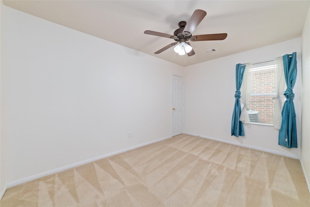 unfurnished room with light carpet and ceiling fan