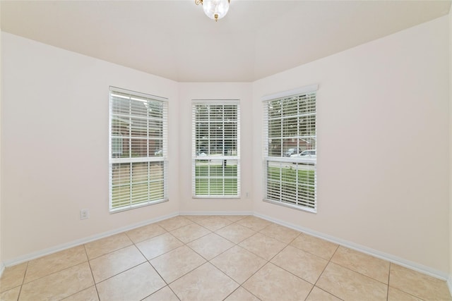 spare room with light tile patterned floors