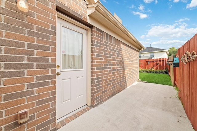 property entrance with a patio