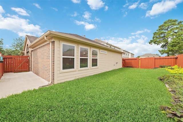 rear view of property featuring a yard