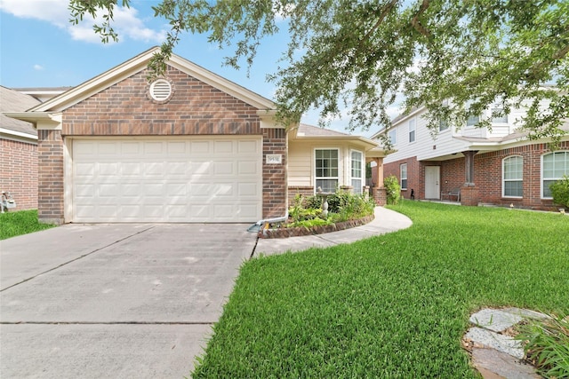 view of front of house with a garage and a front lawn