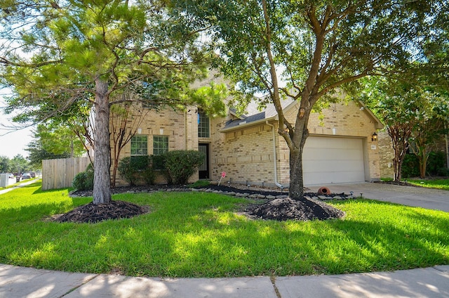 view of front of home with a garage and a front yard