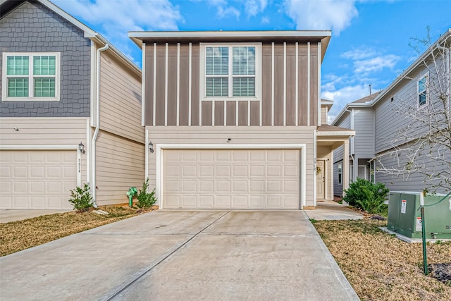 view of front of property featuring driveway and a garage