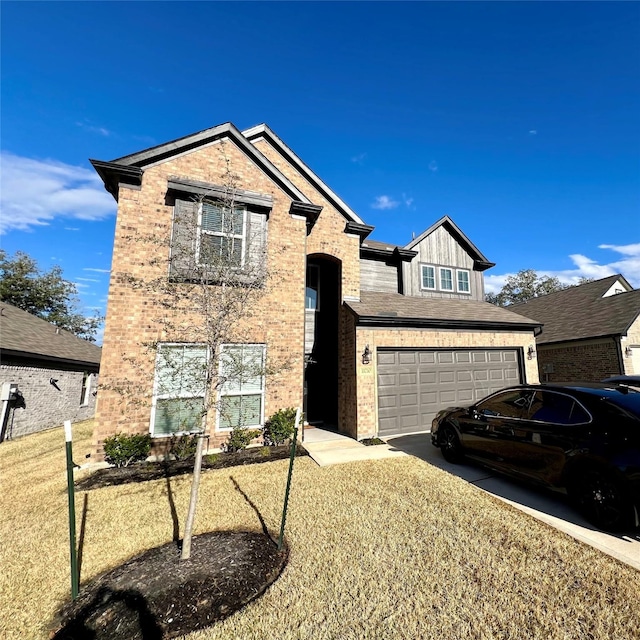 view of front of property featuring a garage and a front yard