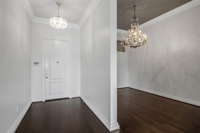 foyer with an inviting chandelier, dark hardwood / wood-style floors, and crown molding