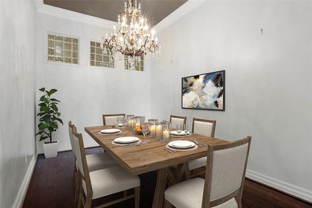 dining space with crown molding and dark hardwood / wood-style floors