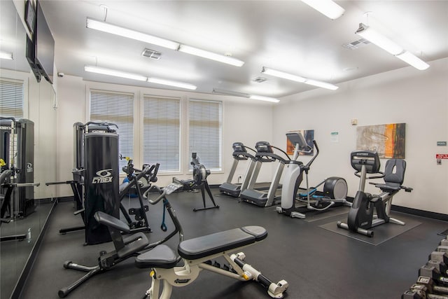 workout area with baseboards and visible vents