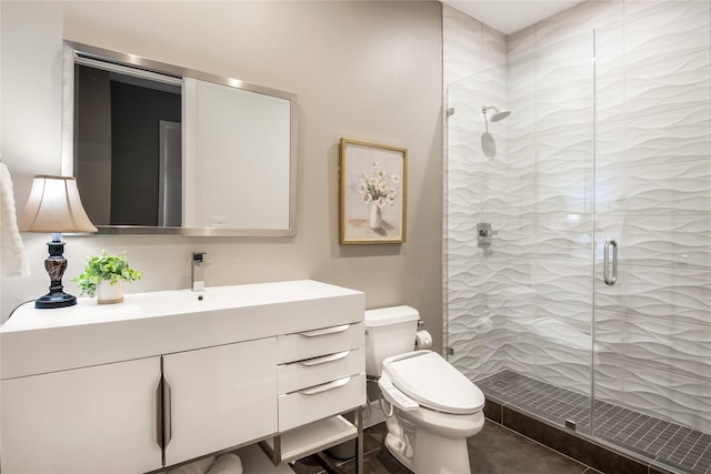bathroom featuring vanity, a stall shower, and toilet