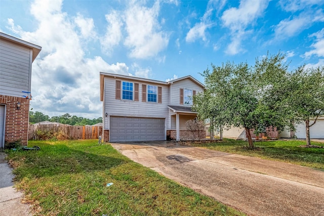 view of front of property featuring a garage and a front yard