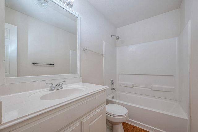 full bathroom featuring shower / tub combination, vanity, and toilet