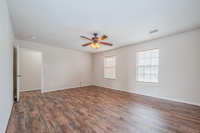 spare room with hardwood / wood-style flooring and ceiling fan