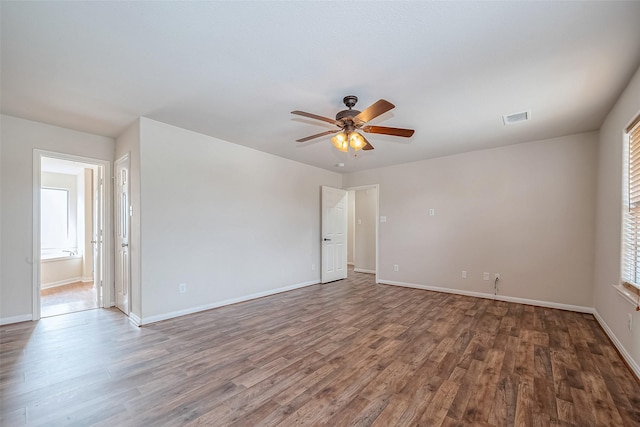 unfurnished room with wood-type flooring and ceiling fan