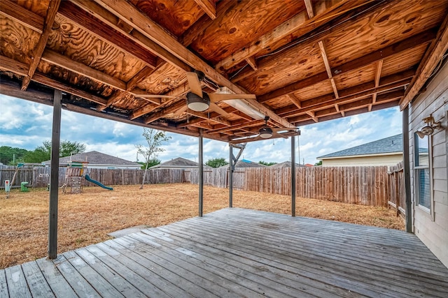 wooden terrace with a playground