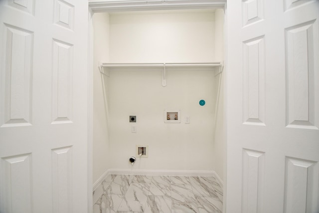 clothes washing area with hookup for a gas dryer, washer hookup, and hookup for an electric dryer