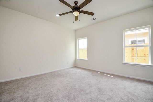 carpeted empty room with ceiling fan