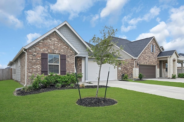 craftsman-style home with a garage and a front yard