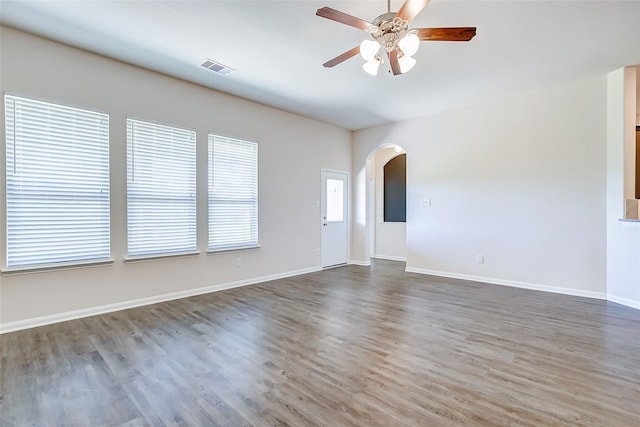 unfurnished room featuring hardwood / wood-style flooring and ceiling fan