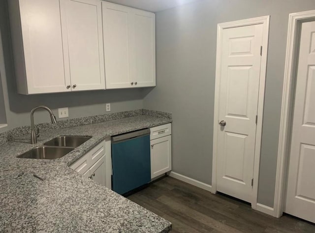 2606 Carson Dr, Katy, TX 77493 - kitchen featuring dark wood-style floors, white cabinetry, dishwasher, and a sink