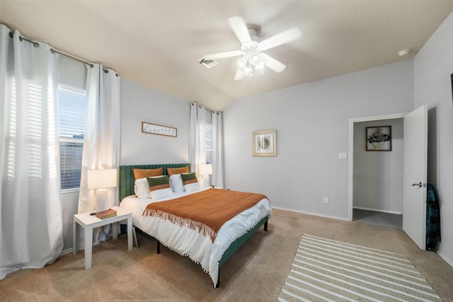 carpeted bedroom with vaulted ceiling and ceiling fan