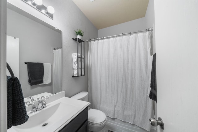 full bathroom featuring vanity, shower / tub combo with curtain, and toilet