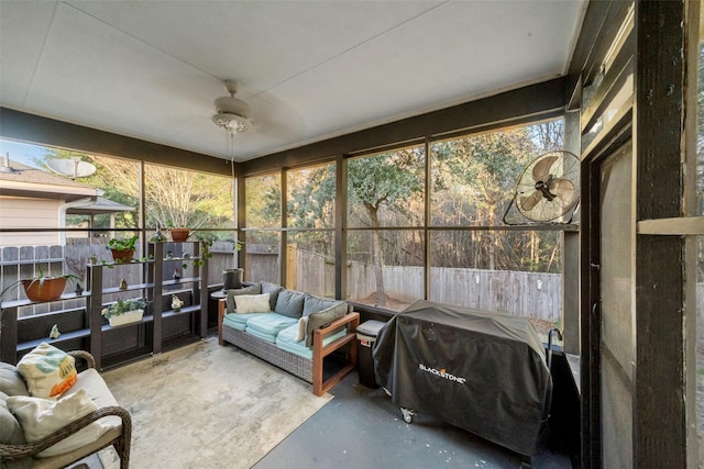 sunroom featuring plenty of natural light and ceiling fan