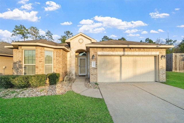 ranch-style home with a garage and a front lawn