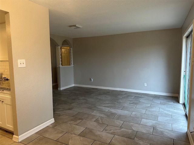 view of tiled spare room