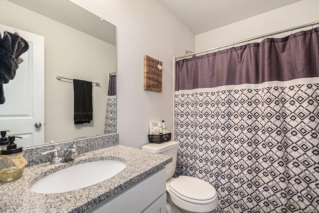 bathroom with vanity, toilet, and a shower with shower curtain