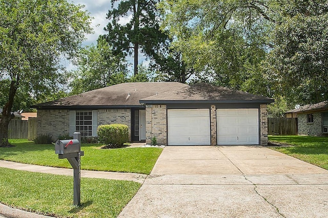 ranch-style house with a garage and a front yard