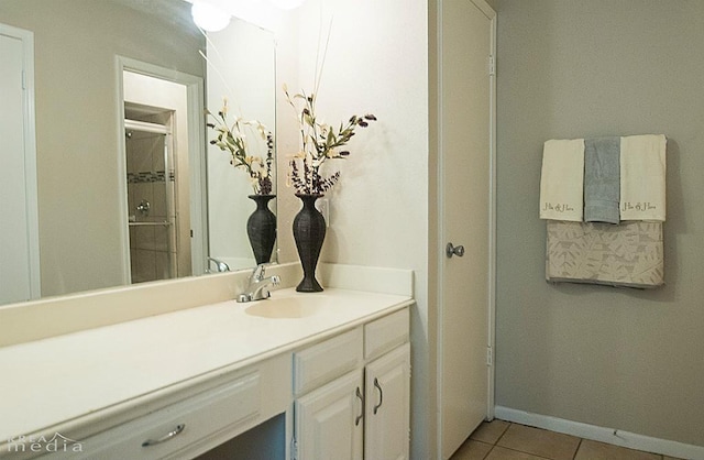 bathroom featuring tile patterned flooring and vanity