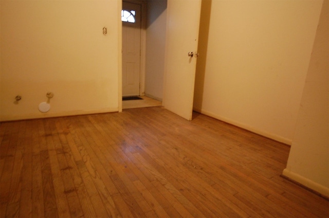 spare room featuring light wood-type flooring