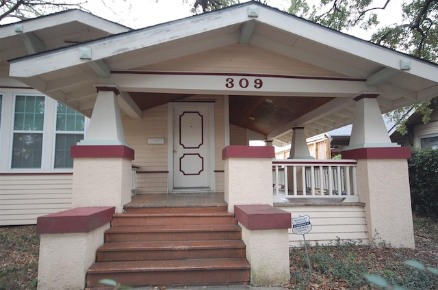 doorway to property featuring a porch