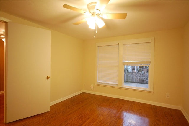 spare room featuring hardwood / wood-style floors and ceiling fan