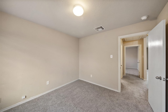 spare room with light carpet