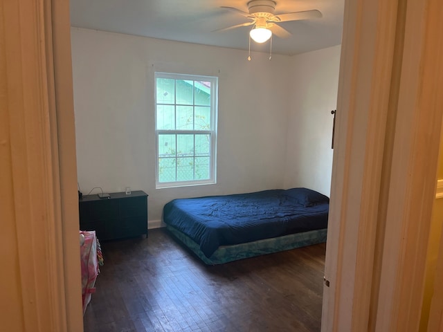 bedroom featuring dark hardwood / wood-style floors and ceiling fan