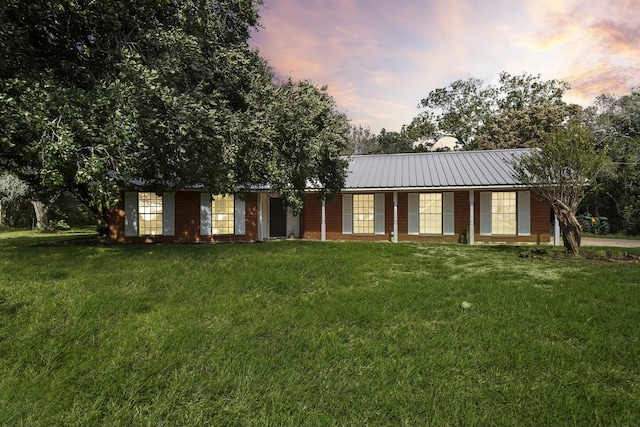 ranch-style house with a lawn