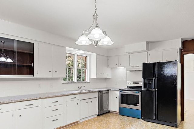 kitchen featuring sink, white cabinetry, appliances with stainless steel finishes, pendant lighting, and decorative backsplash