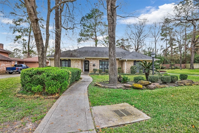 single story home with a front yard