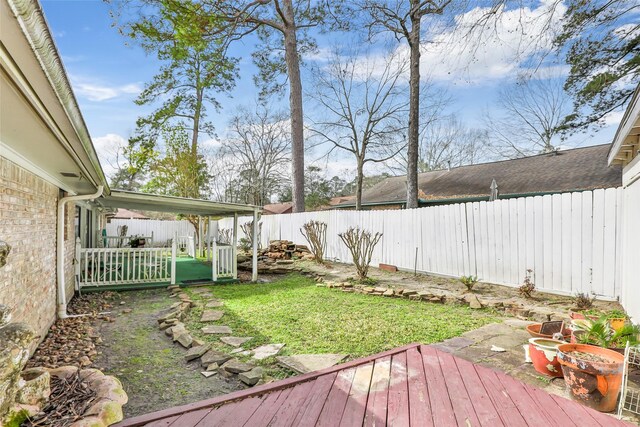 735 Angelina Dr, Conroe, TX 77302 - view of yard featuring a fenced backyard and a wooden deck
