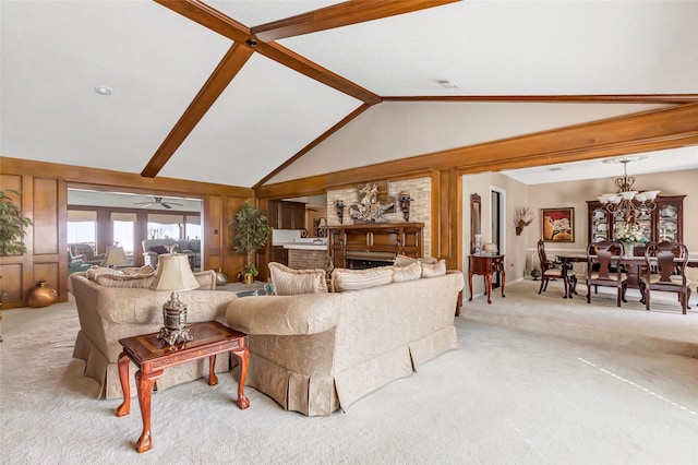 living room featuring light colored carpet, lofted ceiling with beams, and a notable chandelier