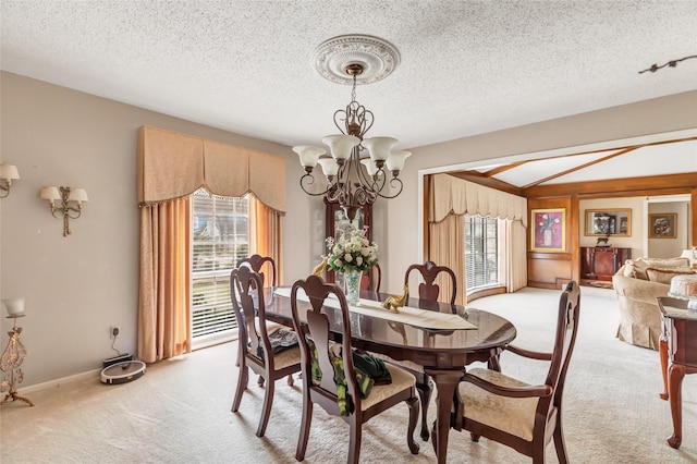 735 Angelina Dr, Conroe, TX 77302 - dining space featuring a textured ceiling, light colored carpet, baseboards, an inviting chandelier, and vaulted ceiling