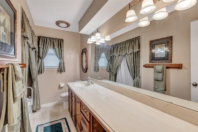 bathroom with vanity and toilet