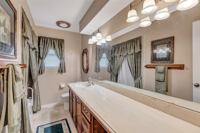 735 Angelina Dr, Conroe, TX 77302 - bathroom with baseboards, an inviting chandelier, toilet, and vanity